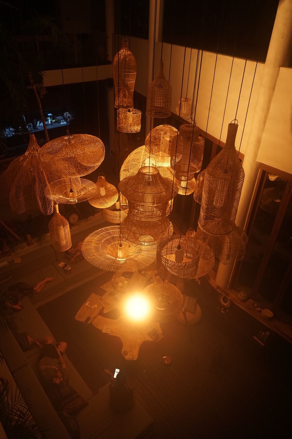 Open-plan room lit by a single AVA Light from above, showing the spatial coverage