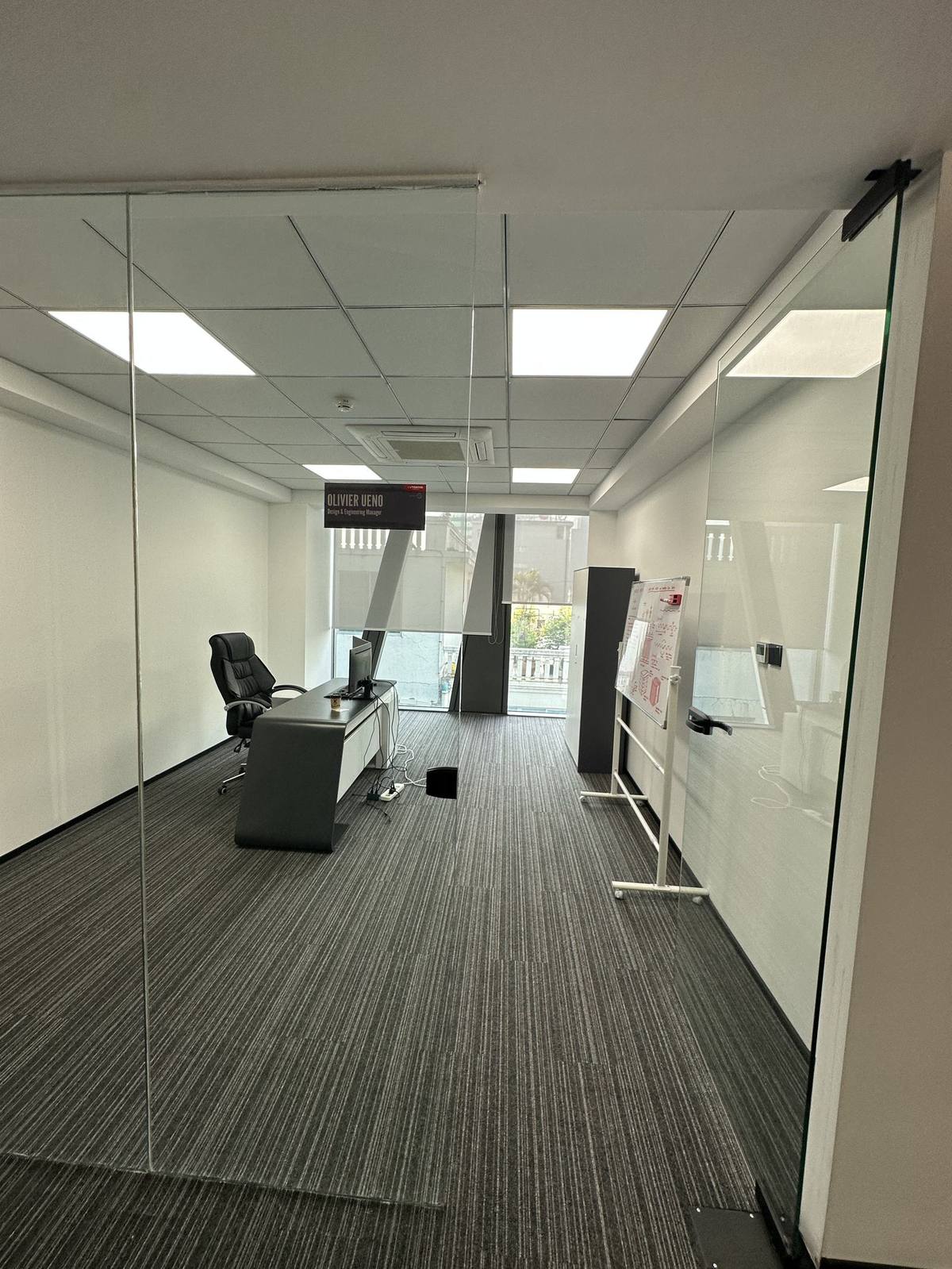 Engineering and Design Department office, title sign over the desk, planning whiteboard at the back